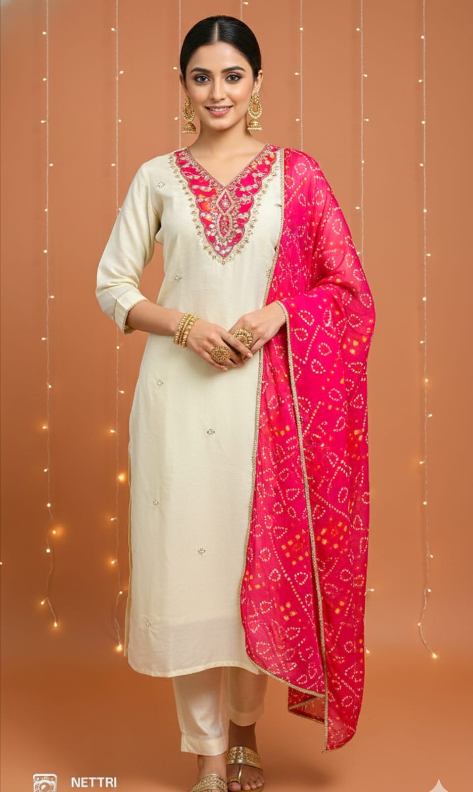 Cream 3-piece fancy suit with Bandhej applique handwork on pure tissue shimmer fabric, includes Santoon pants and pure Chinon printed dupatta – elegant ethnic wear for women, sizes M to XXL